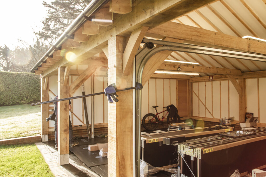 Installation of Hormann ART42 VItraplan sectional garage doors in black