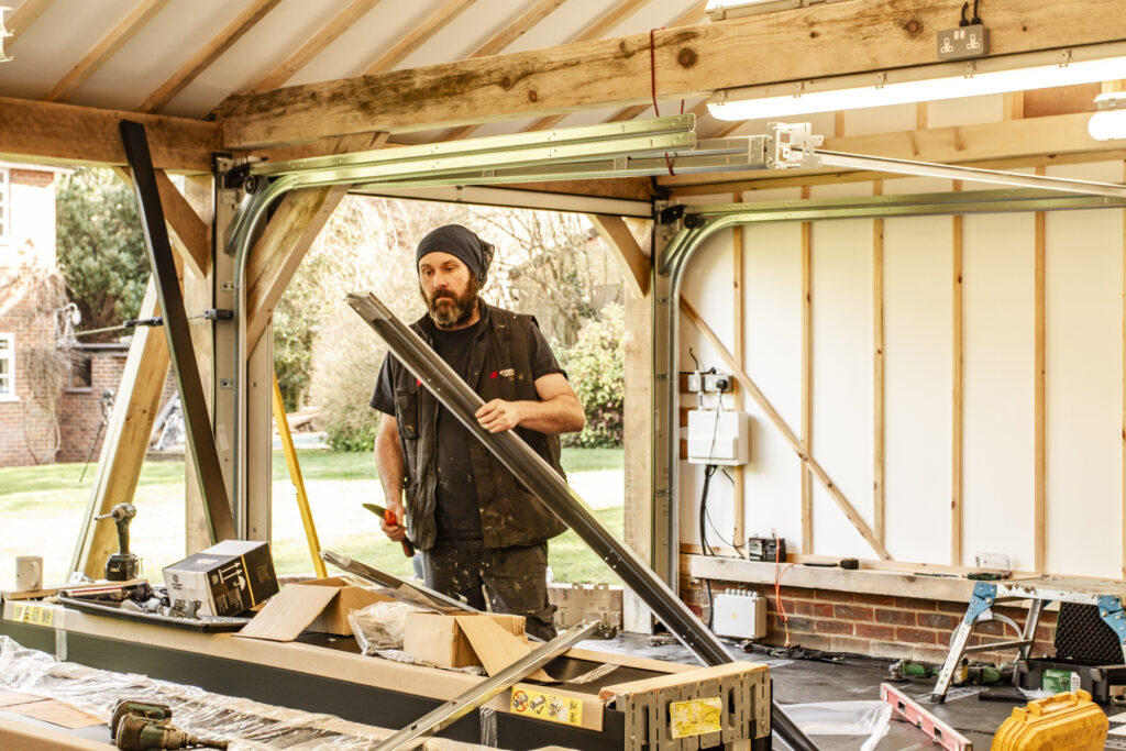 Installation of Hormann ART42 VItraplan sectional garage doors in black