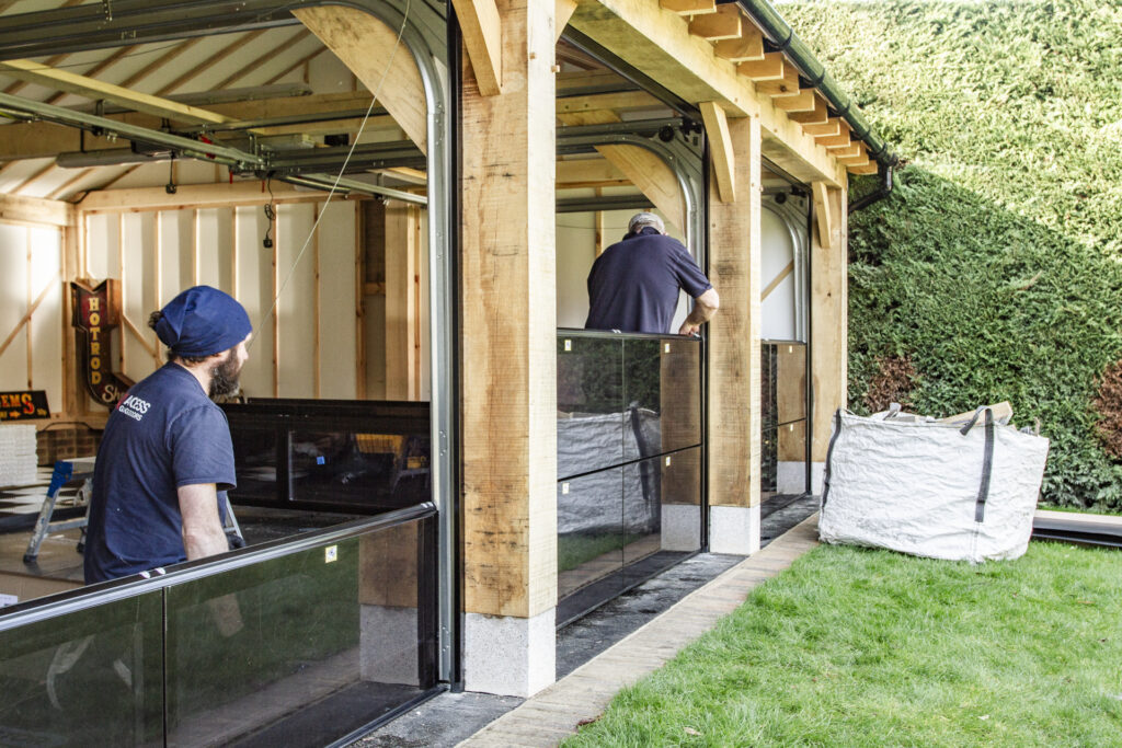 Installation of Hormann ART42 VItraplan sectional garage doors in black