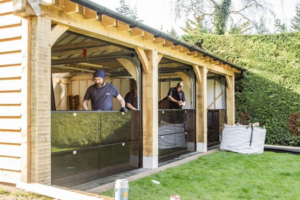 Installation of Hormann ART42 VItraplan sectional garage doors in black