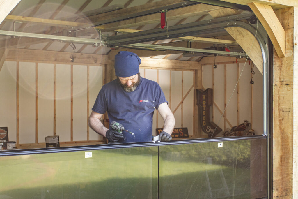 Installation of Hormann ART42 VItraplan sectional garage doors in black