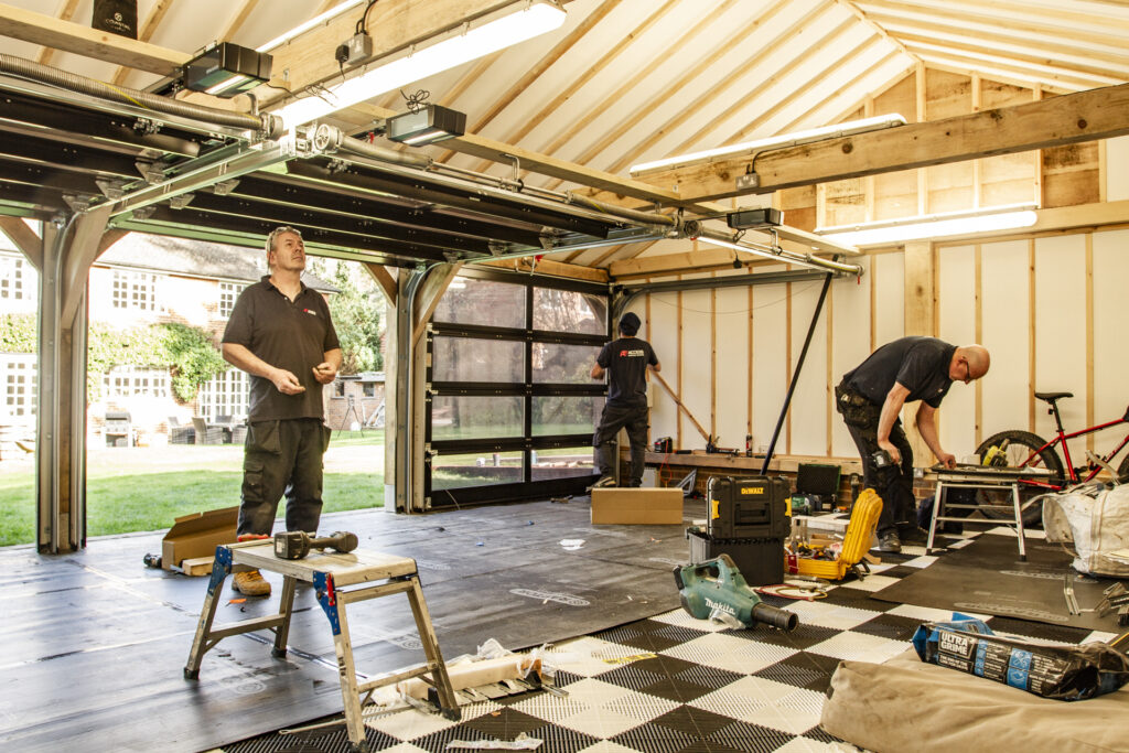 Installation of Hormann ART42 VItraplan sectional garage doors in black