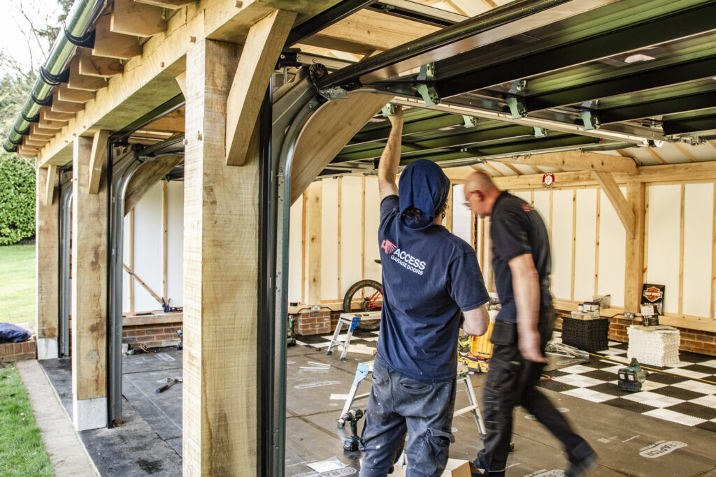 Installation of Hormann ART42 VItraplan sectional garage doors in black