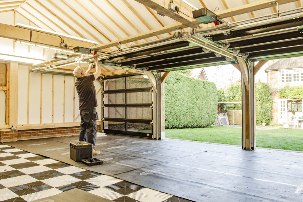 Installation of Hormann ART42 VItraplan sectional garage doors in black