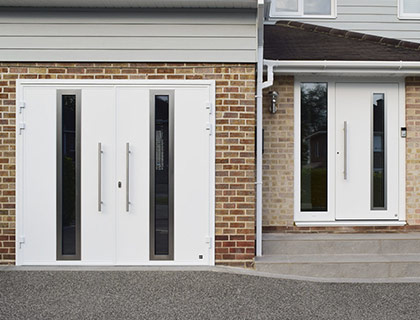 Matching Ryterna side hinged garage doors and front doors