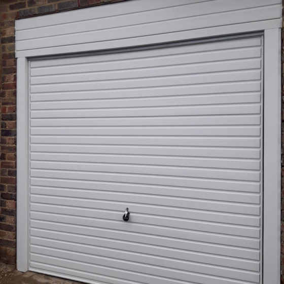 A Hormann LPU42 L-Ribbed Sectional Garage Door + Wicket Door finished ...