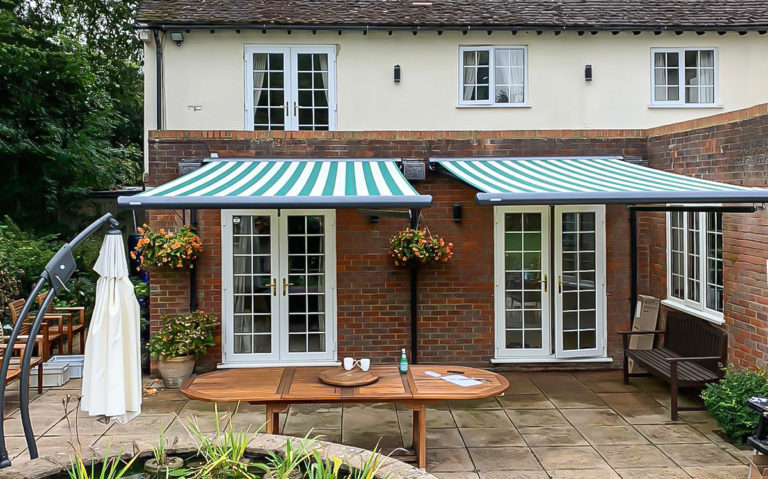 A Pair Of Markilux 1600 Stretch Semi-cassette Retractable Awnings